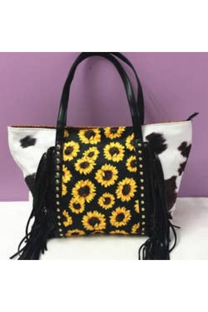 Handbag with sunflower pattern and cowhide design on a purple background