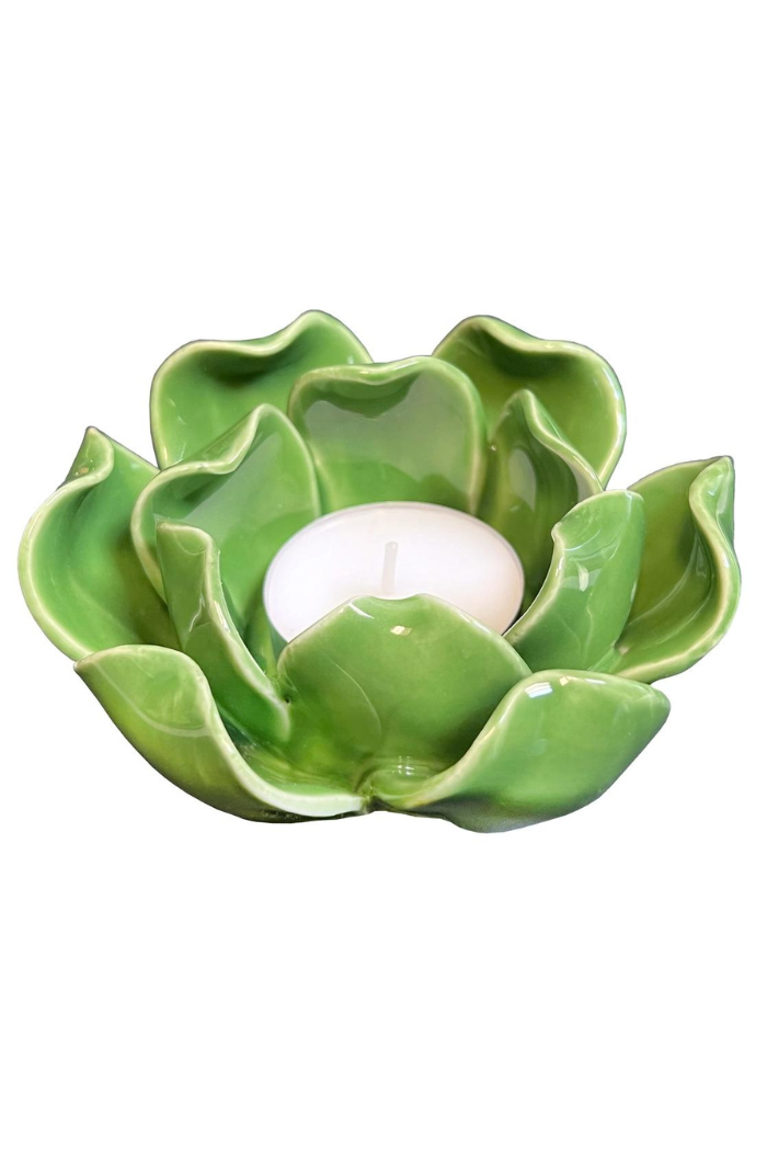 Green ceramic lotus candle holder with a white tea light candle.