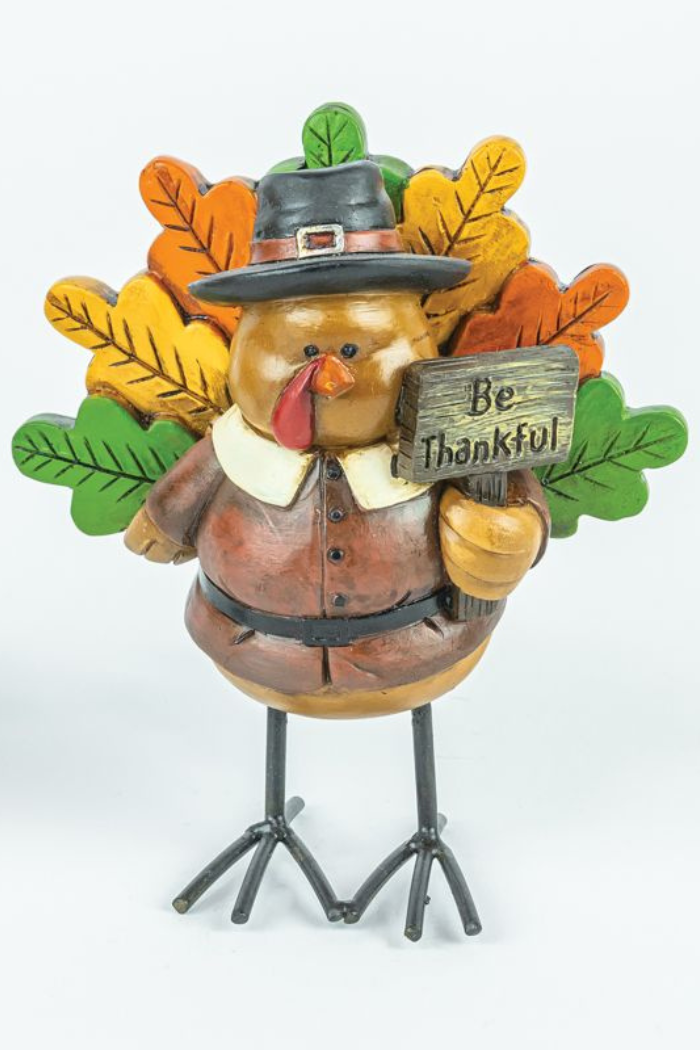 Add festive cheer to your home with the Pilgrim Turkey Stand, featuring a âBe Thankfulâ sign and a vibrant tail of orange, yellow, and green leavesâperfect Thanksgiving dĂ©cor.