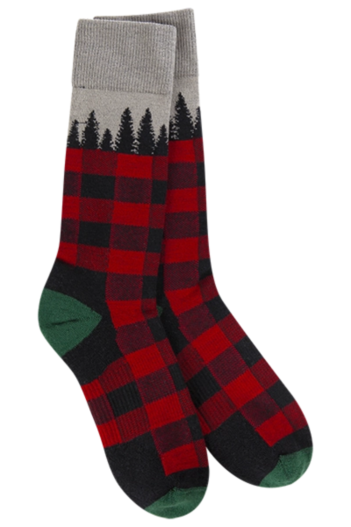 A pair of crew-length socks featuring a red and black buffalo plaid pattern on the lower and mid-calf sections, transitioning to a grey cuff with a black pine tree forest silhouette design at the top. The heel and toe sections are dark green.