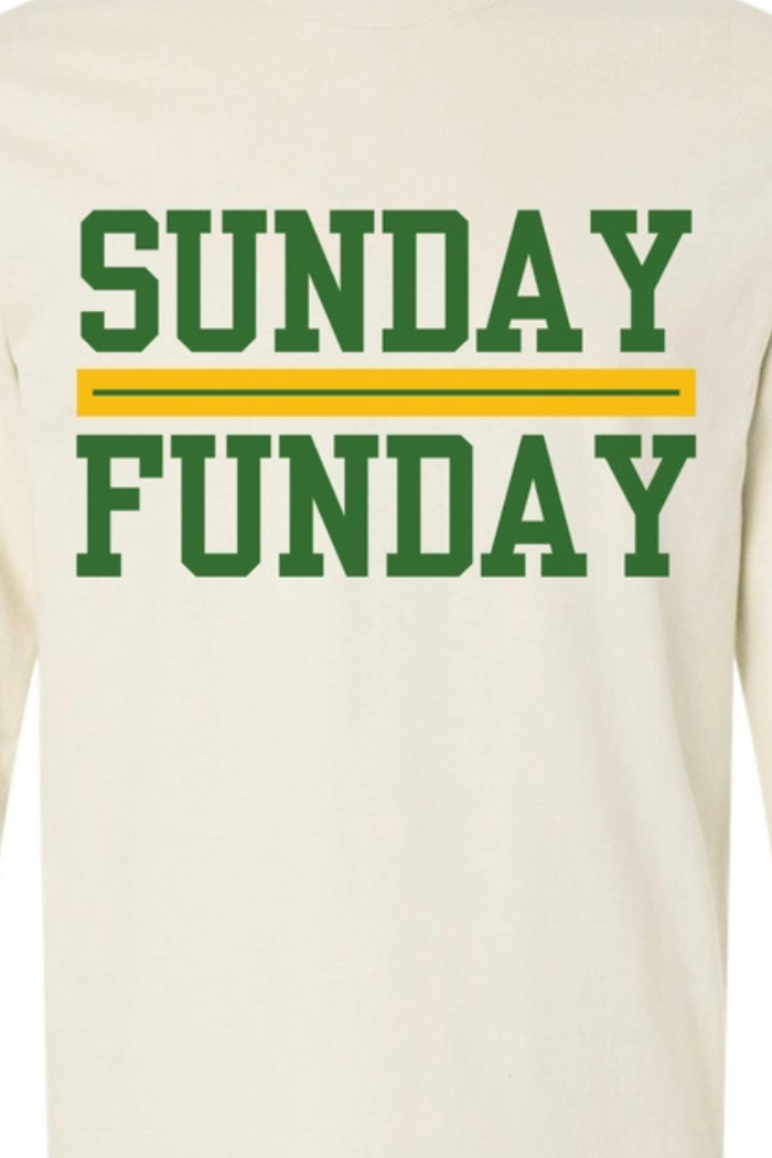 A cream-colored long-sleeve t-shirt with the phrase "SUNDAY FUNDAY" printed in green capital letters, separated by a horizontal yellow and green stripe.