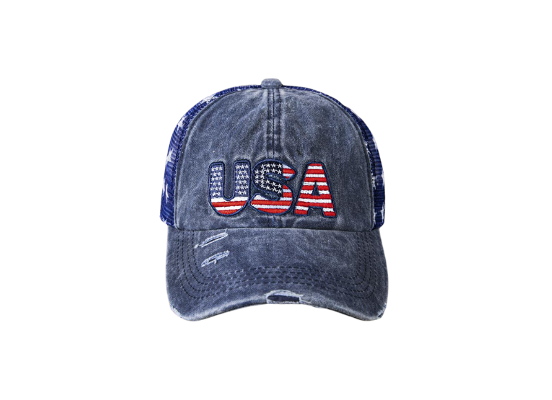 A distressed denim baseball cap with the letters "USA" embroidered on the front in a red, white, and blue American flag pattern. The cap also features a mesh back and a slightly curved brim. It appears to be a casual and patriotic style, likely intended for everyday wear or to show support for the United States. The distressed look gives it a vintage or worn-in feel.