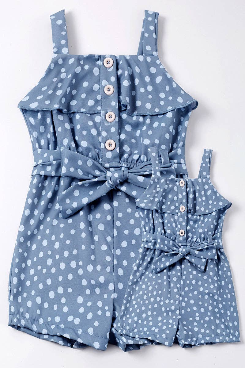 Blue polka-dot romper features a ruffled neckline, button-down front, and a tie belt at the waist.