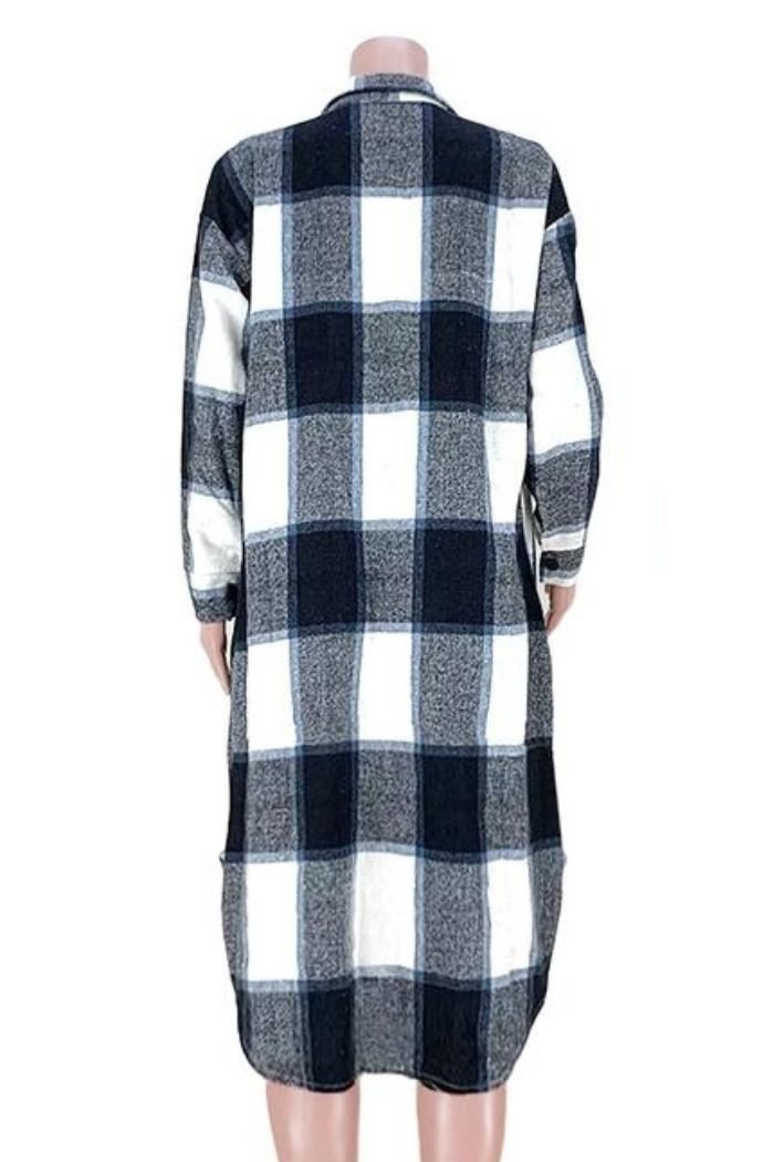 Black and white checkered dress on a mannequin against a white background