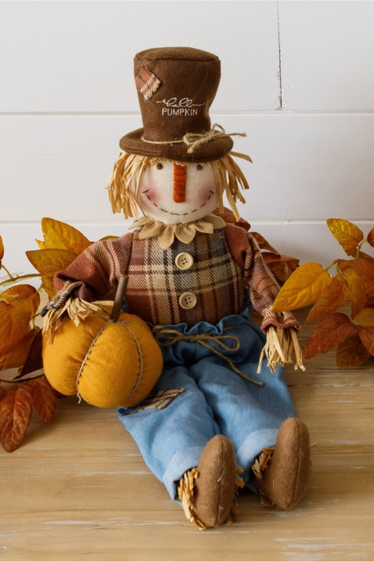 Scarecrow Sitter Holding Pumpkin