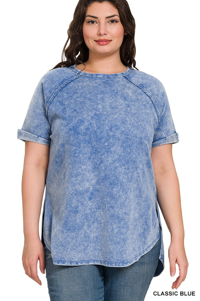 Woman wearing a blue acid-wash t-shirt with 'Classic Blue' text at the bottom.