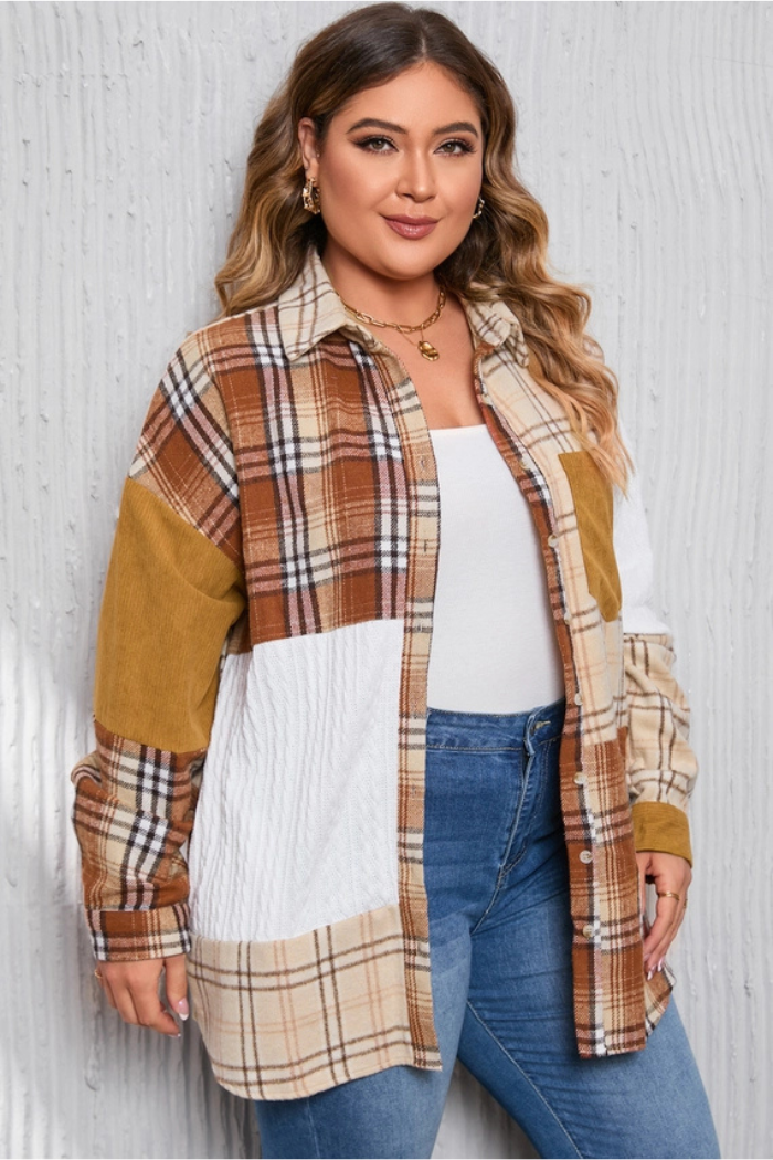 A woman wearing a patchwork plaid shirt jacket with a mix of brown, beige, and white plaid patterns, along with solid brown corduroy and textured white fabric patches. The jacket has a button-down front and a pocket on the left chest area. She is also wearing a white top underneath and blue jeans. She has long, wavy blonde hair and is wearing a necklace and earrings. She is smiling and looking at the camera.
