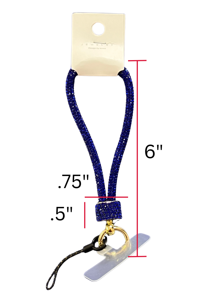 A blue, glittery wrist strap or short lanyard for a phone or keys is displayed against a white background, hanging from a small cardboard tag labeled "JEWELRY." The strap features a gold-colored split key ring and a black cord loop with a clear plastic tether tab for attaching to a phone case.