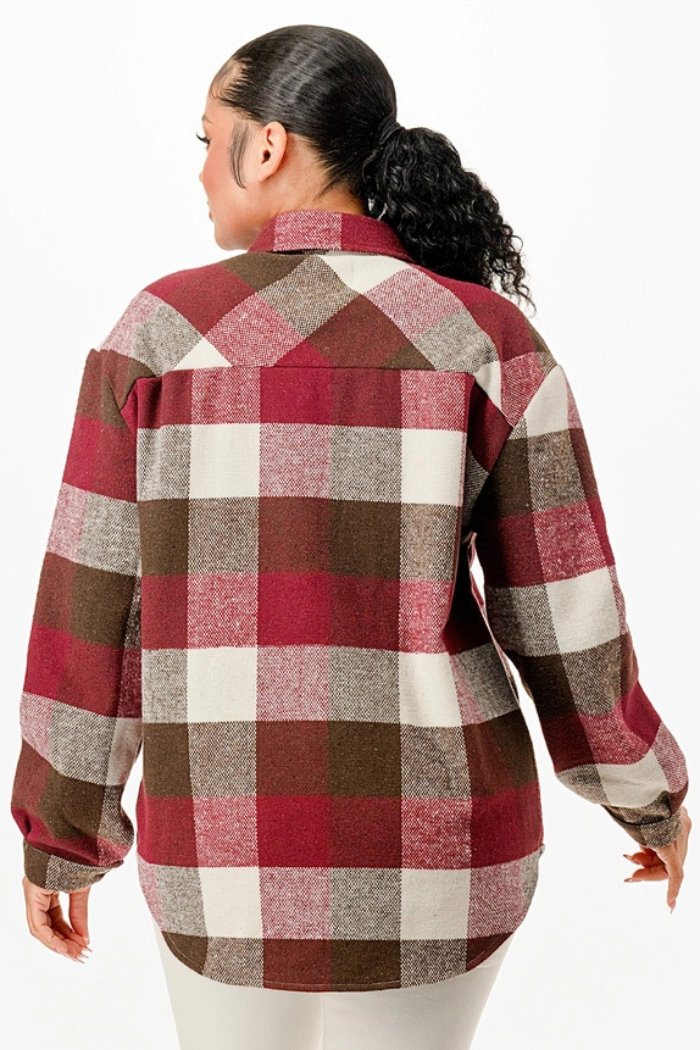 A person is shown from the back, wearing an oversized, long-sleeved plaid flannel shacket in a pattern of burgundy, brown, and white.