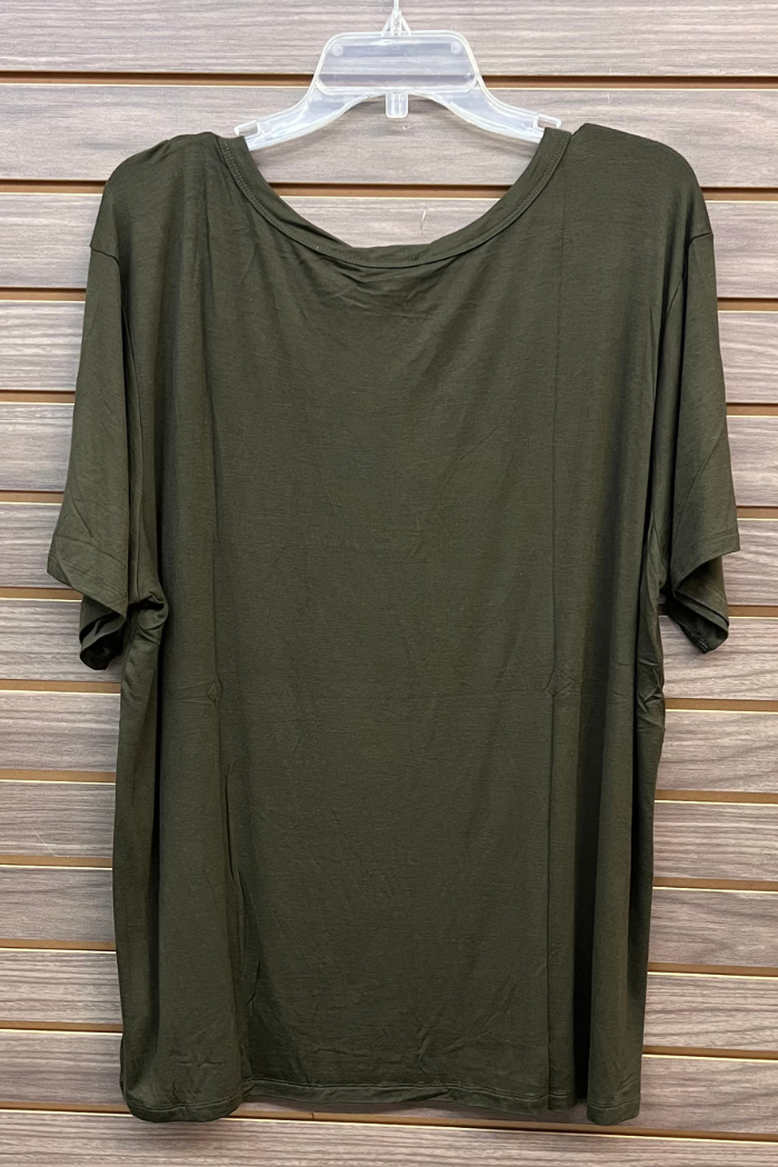 A Plus Size Rayon Tee in dark olive green, short-sleeved and made from a soft rayon blend, hangs on a clear plastic hanger against a wooden paneled background.