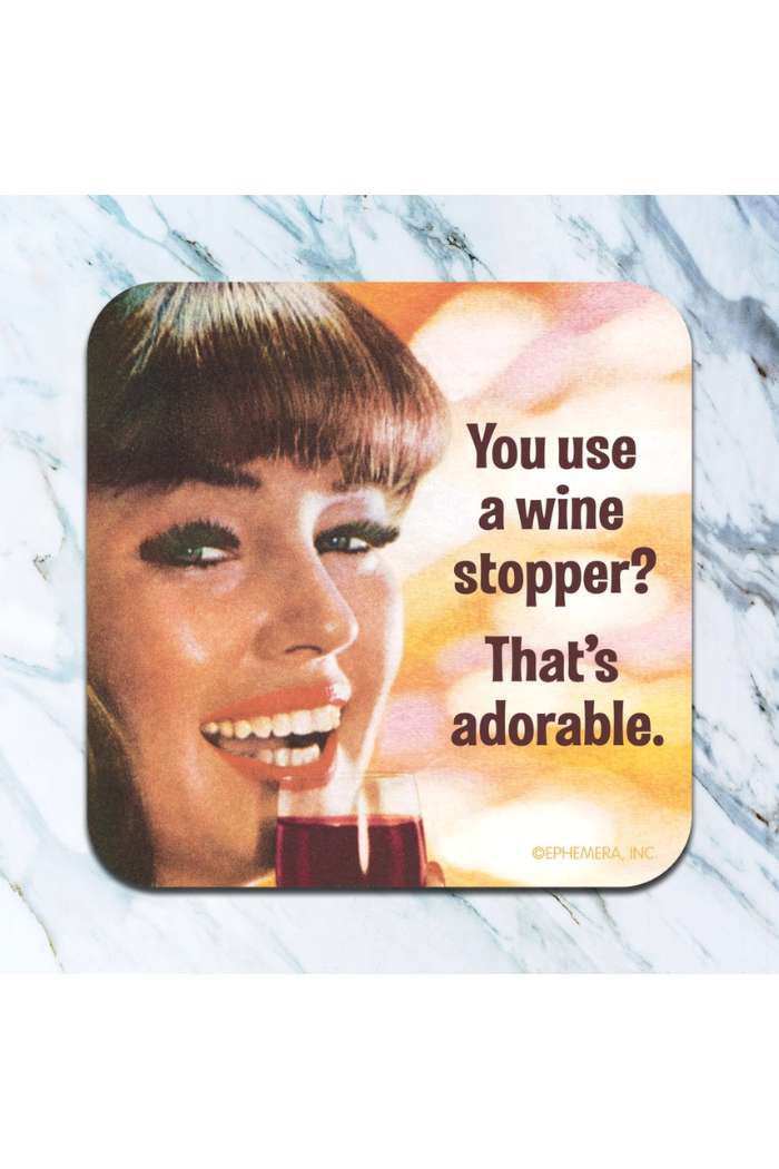 A smiling woman with bangs holds red wine beside the text, “You use a wine stopper? That’s adorable.” Set on marble, this Retro Humor Drink Coasters image features playful humor and warm retro colors.