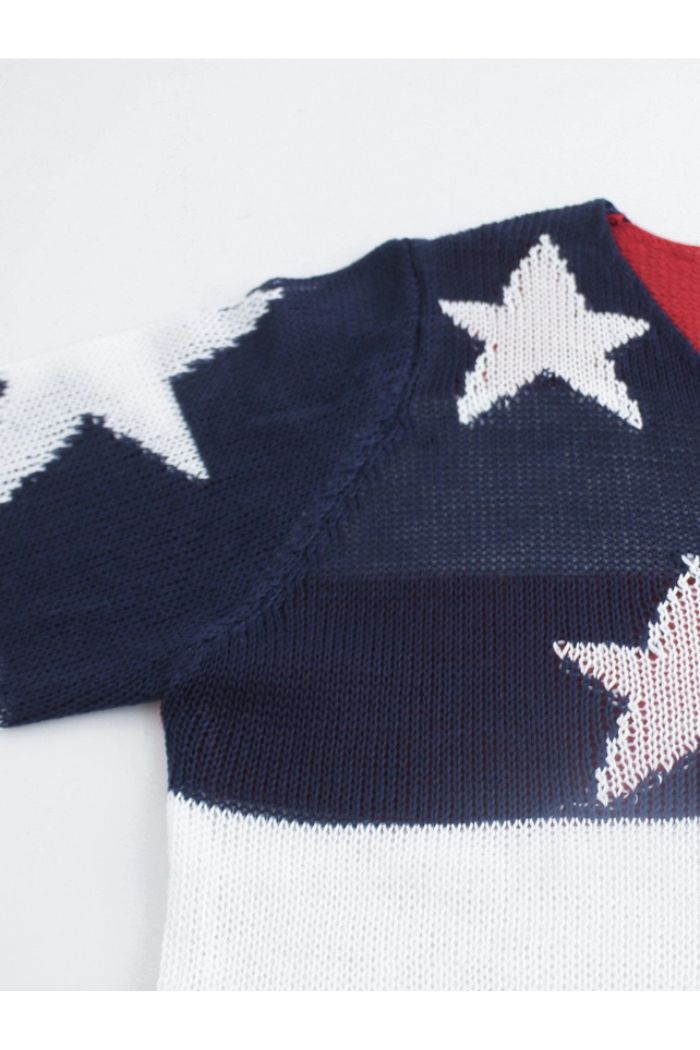Close-up of the American Flag Knit Sweater shows a navy blue section with white stars, capturing part of the sleeve and shoulder for a patriotic look.