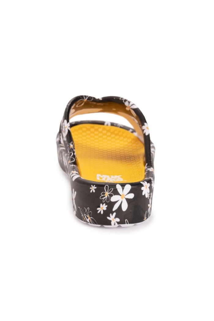 The Black Floral Slip-On Sandals feature white and yellow patterns, a yellow textured insole, Skechers branding in white, and an EVA design for stylish everyday comfort. Shown from the back.
