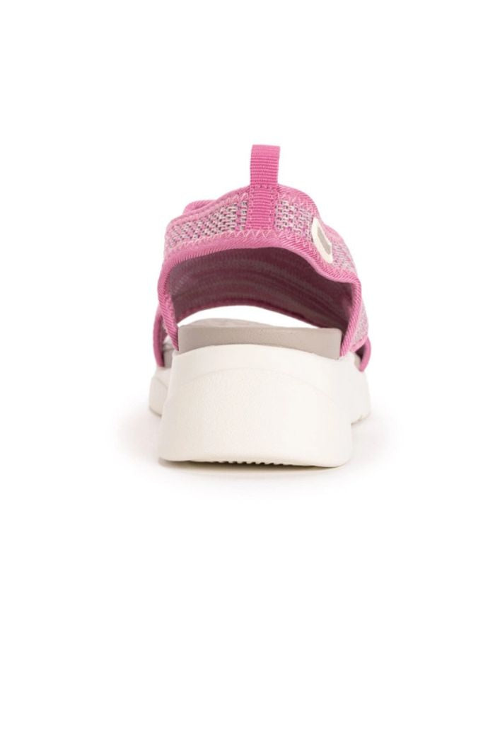 Rear view of the Muk Luks Zahara Sandals featuring a pink knit upper, white cushioned platform sole, and heel pull tab, displayed against a plain white background.