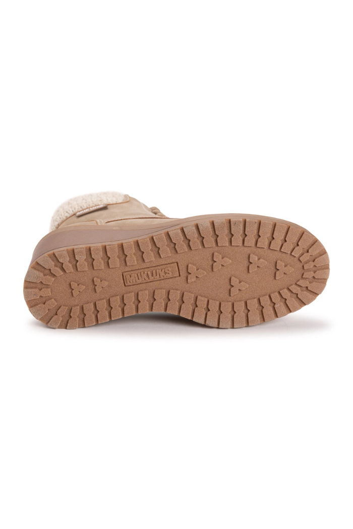 The image shows the bottom view of tan Sky Solange Wedge Boots, featuring a textured rubber sole with treads and a light faux fur trim on the upper, combining style and coziness in these faux leather winter boots.