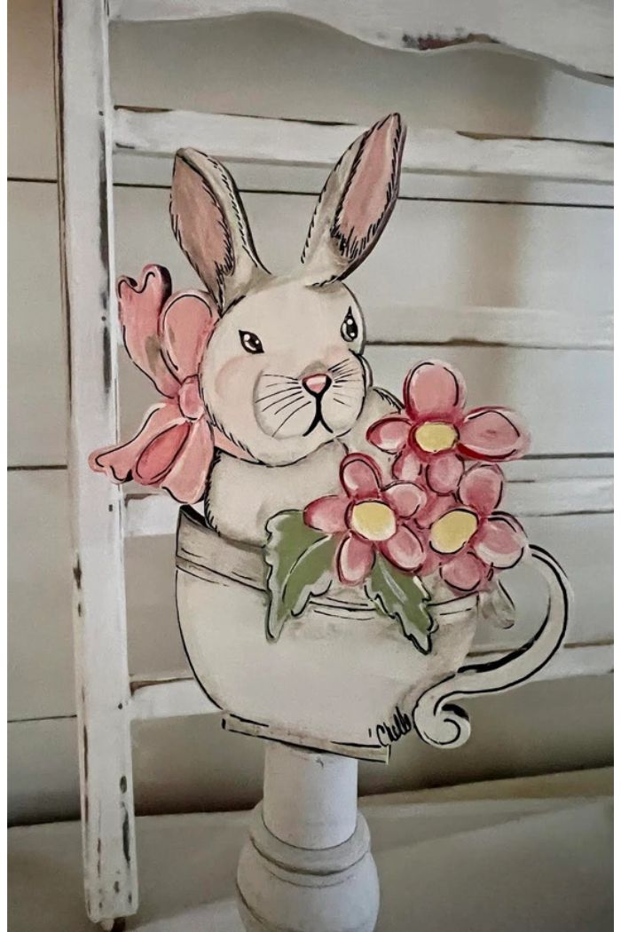 Add a charming touch to your home with Spring Summer Wood Toppers featuring a bunny with a pink bow sitting in a teacup of pink flowers on a white wood background—perfect spring or summer décor.