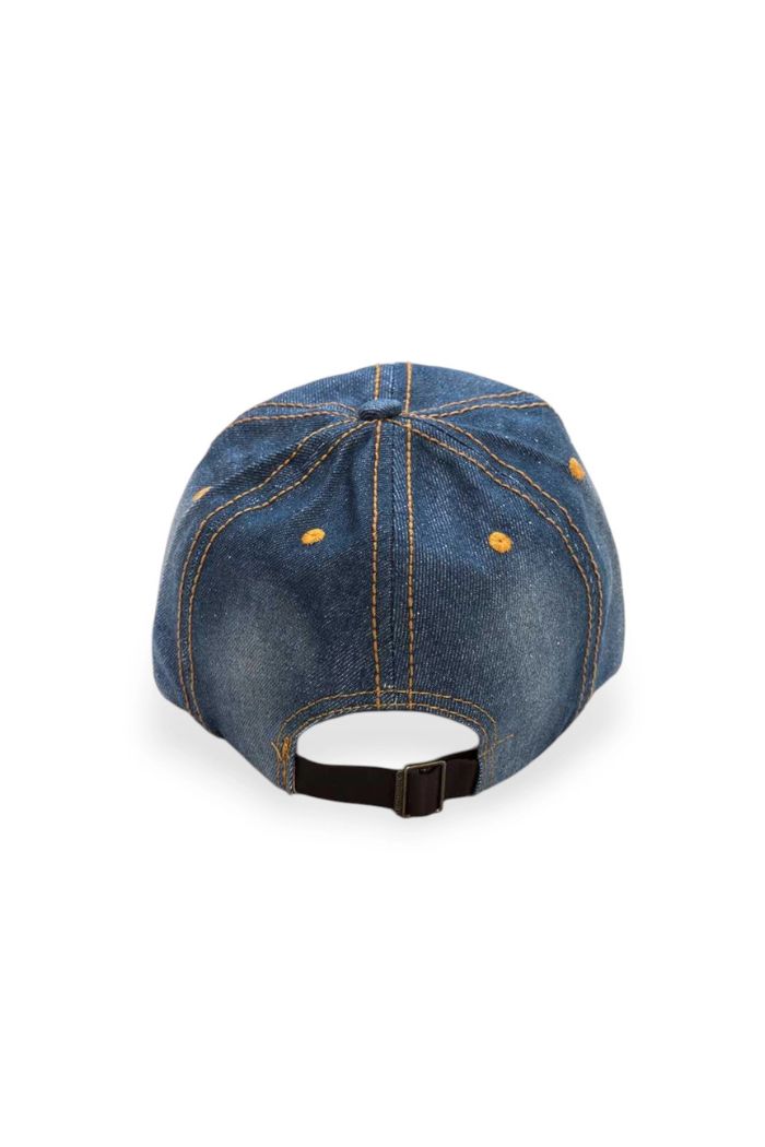 The USA Crystal Baseball Cap is shown from the back in blue denim, featuring yellow stitching, metal eyelets, and an adjustable black strap with a buckle—ideal for fans of classic denim baseball cap style.
