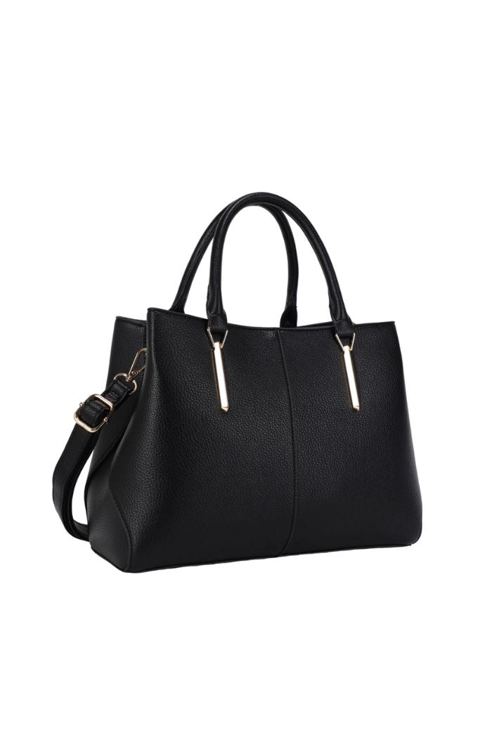 The Corina Satchel Bag is a structured black bag with gold-tone accents, two top handles, and a detachable shoulder strap, crafted from vegan leather and shown against a white background.