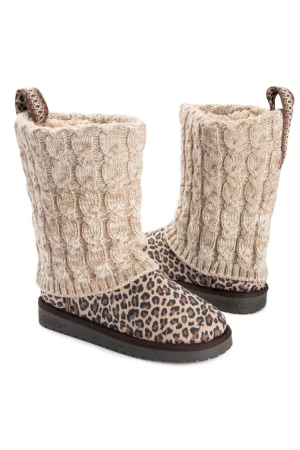 MUK LUKS Cheryl Leopard Boots featuring mid-calf leopard print, beige cable-knit shafts, heel pull tabs, and brown rubber soles.