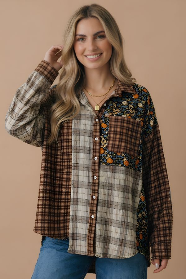 Smiling woman with long blonde hair wearing the Patchwork Button Down Top and blue jeans, accessorized with layered gold necklaces, standing against a beige background.