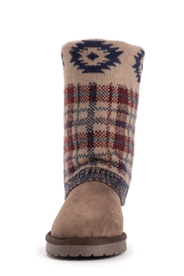 MUK LUKS Cheryl Aztec Plaid mid-calf boots with a water-resistant brown suede-like foot and a knit shaft featuring a blue Aztec pattern over a red and blue plaid design.