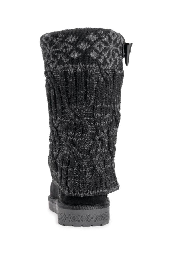 Black cable-knit mid-calf MUK LUKS Cheryl Toggle Boots with a patterned knit cuff, toggle closure, and textured rubber sole.