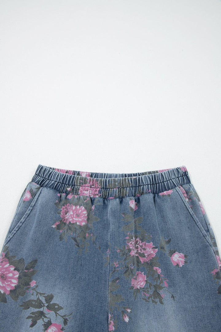 Floral Pull-On Jeans in light blue, featuring an elastic waistband and pink floral print, displayed from waist to mid-thigh against a plain light background.