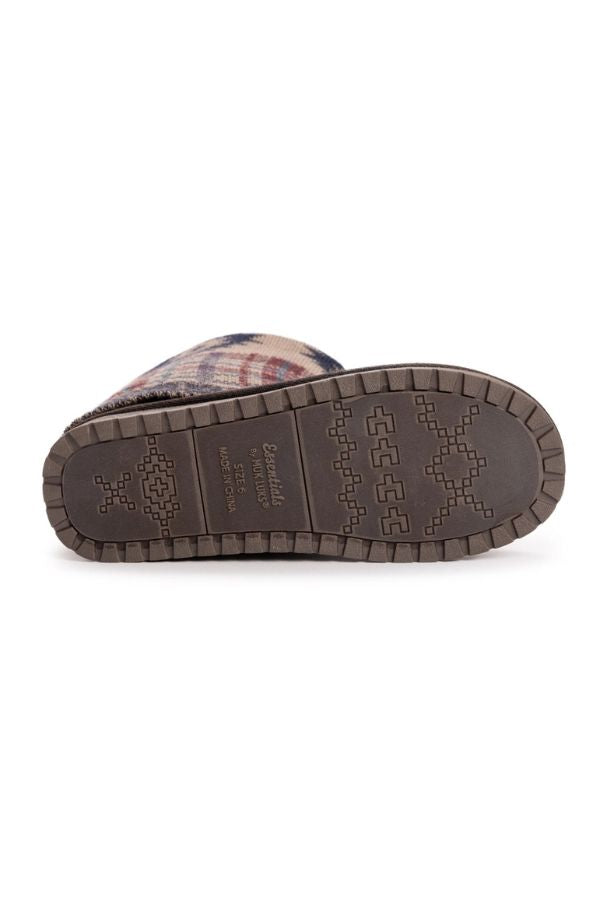 Bottom view of a MUK LUKS Cheryl Aztec Plaid Boot showing a textured geometric fabric upper and a brown rubber sole with a repeating cross and square tread design.