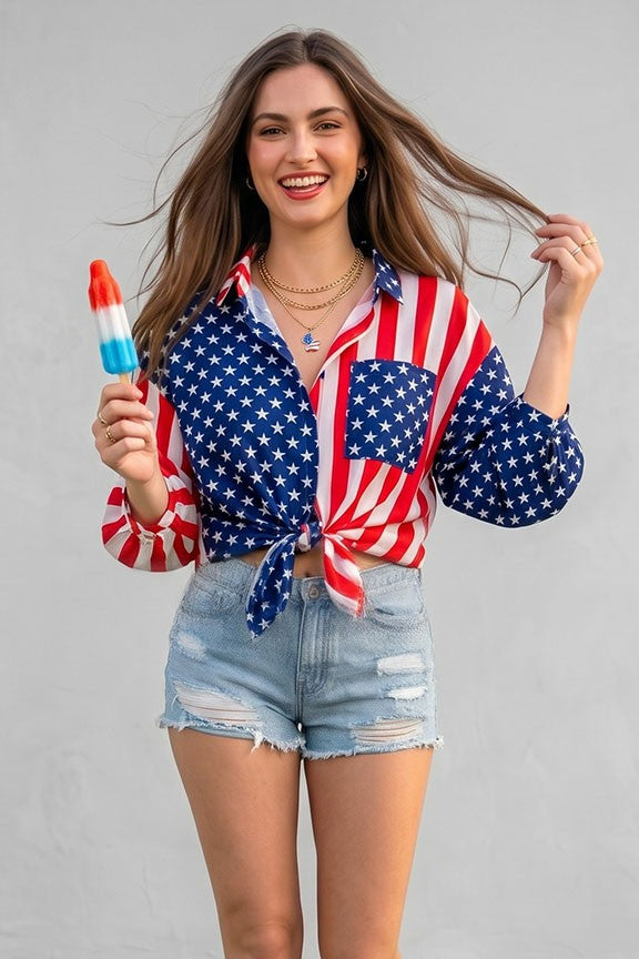 A smiling woman wearing a Patriotic Button Shirt with stars and stripes holds a red, white, and blue popsicle in front of a plain gray background.
