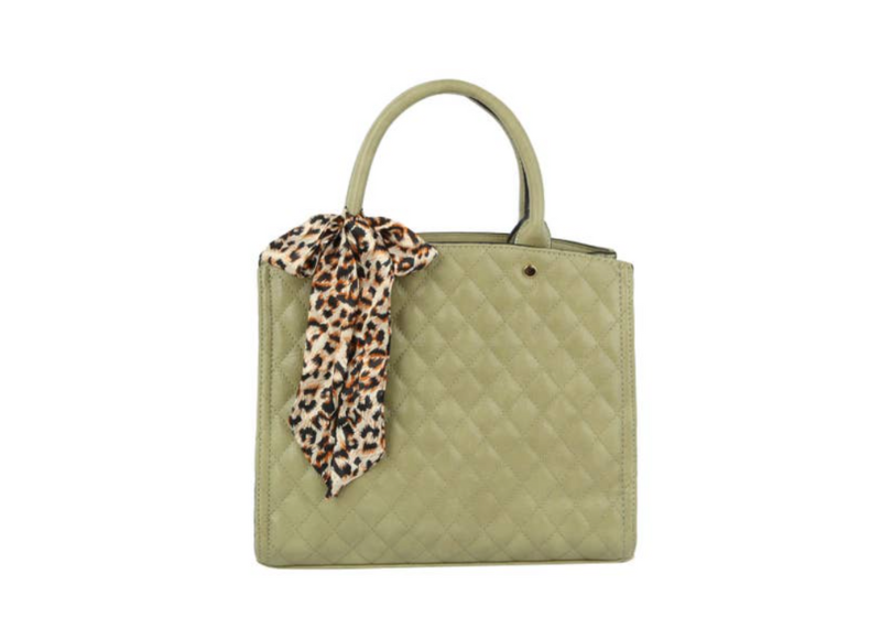 Green quilted handbag with a leopard print scarf on a white background