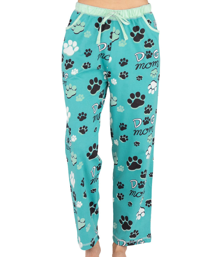 Dog Mom, Cat Nap & More Pajama Pants in turquoise with black, white, and teal paw prints and "DOG mom" text. Cotton pants feature an elastic waistband and drawstring for comfort.