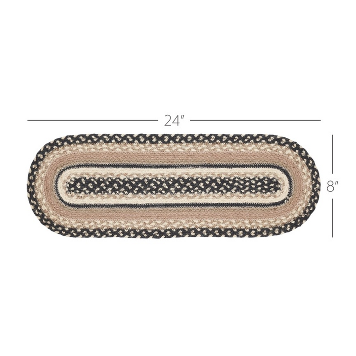 Oval braided rug with dimensions on a white background