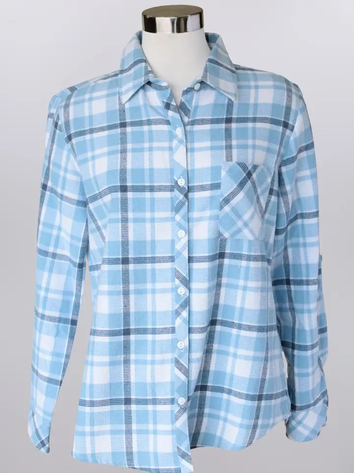 The Plaid Button Shirt is a light blue and white plaid, long-sleeve, button-up cotton shirt displayed on a mannequin, featuring a front chest pocket.
