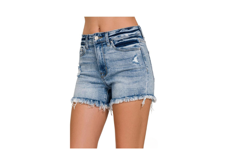 Denim shorts with frayed hem on a white background