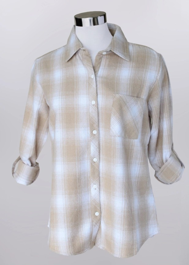 The Plaid Button Shirt, crafted from soft cotton in a beige and white check pattern, features a button-up front and long sleeves rolled to the elbows. It is displayed on a headless mannequin against a plain light background.