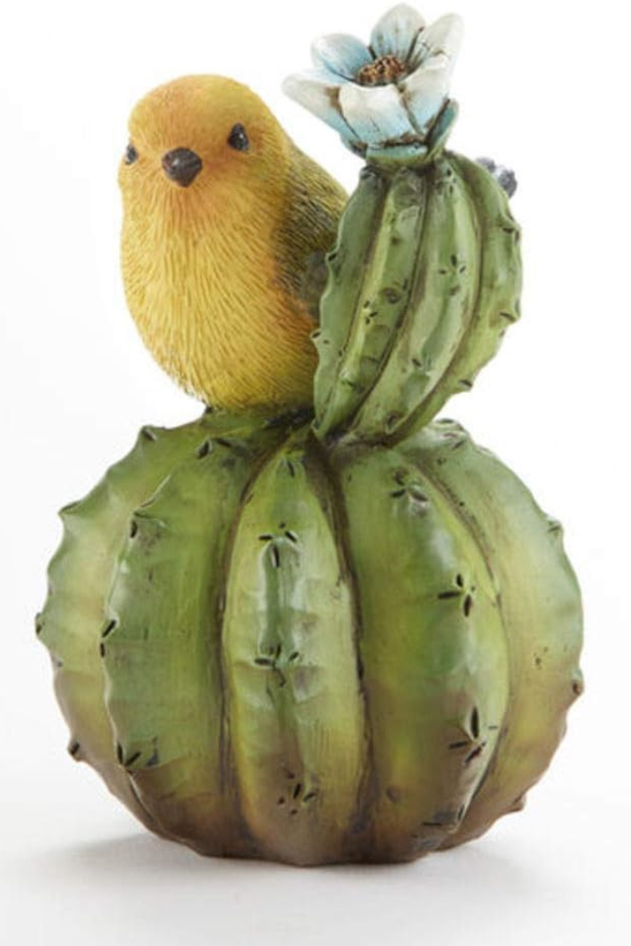 Yellow resin bird on cactus